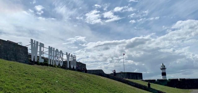 we miss you sign on castle field